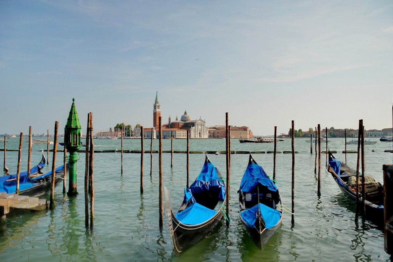 The typical Venetian boat, Gondola, and the St.Mark Bell Tower - Venice